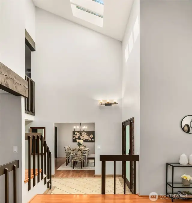 2-story vaulted entry with skylight and beautiful exposed timber detailing