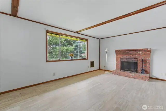 Bright and spacious living room with cozy fireplace