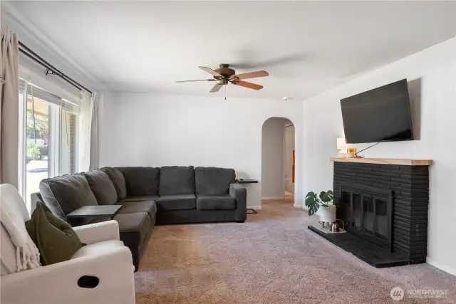 Living room with wood burning fireplace