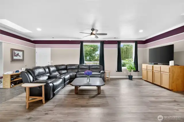 Living room with large windows and versatile layout options