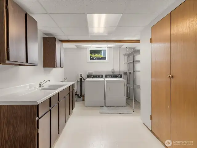 Large laundry room with sink and tons of storage