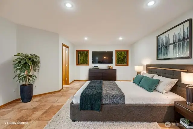 Virtually staged beautifully lit Primary bedroom