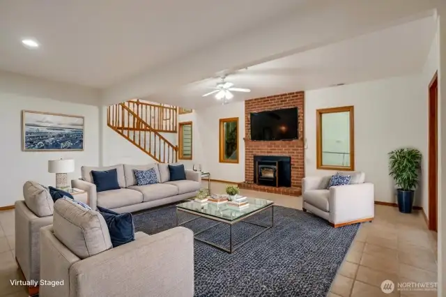 Lower level family room with slider access to large patio and beautiful garden area. Pellet stove insert provides efficient source of heat.