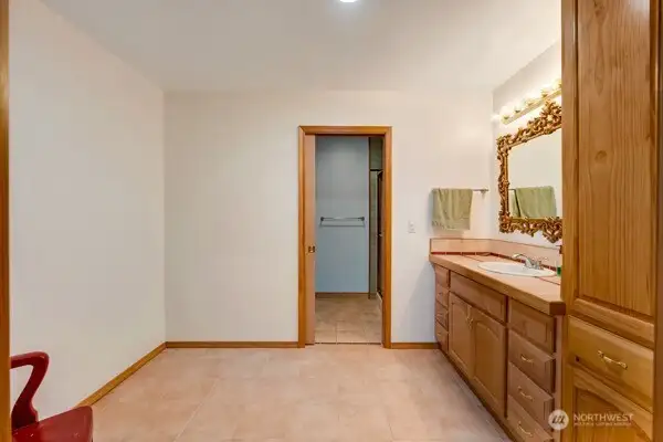 Large vanity and storage cabinet with flex space to add additional storage or vanity with a door that separates the water closet.