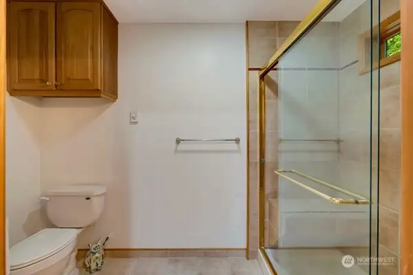 Private toilet and walk in shower in the third bathroom.