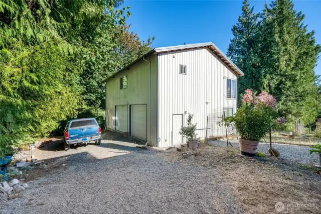Detached 2,400 sqft, two story shop with wrap around driveway that leads to second property access.