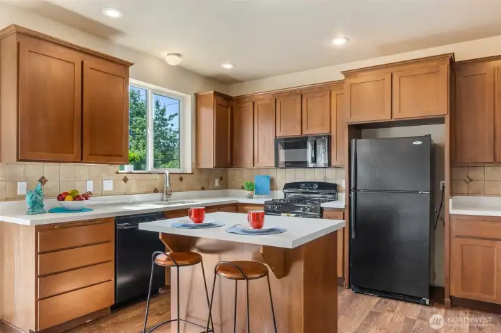 The spacious kitchen has an island for prep and casual dining