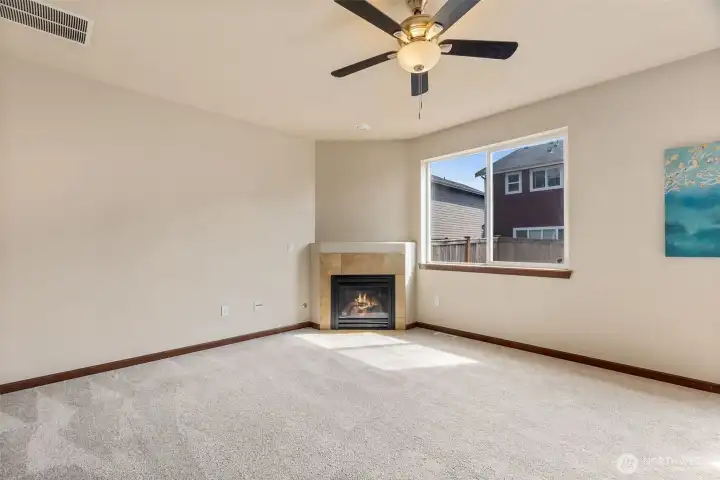 Second living space, this family room features a gas fireplace for cozy Fall nights coming soon