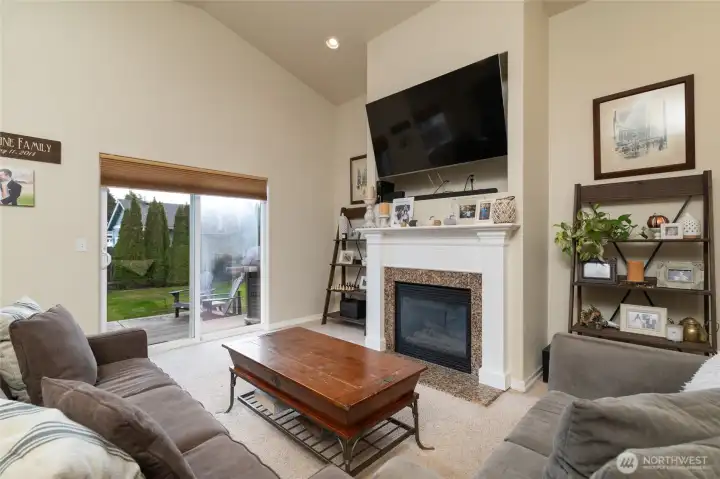 Living with gas fireplace and custom-built mantle