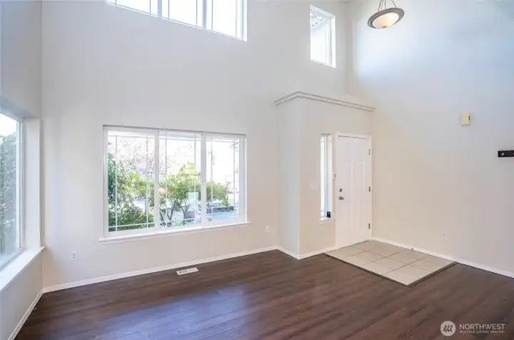 The entry opens to a bright and welcoming living area filled with natural light.