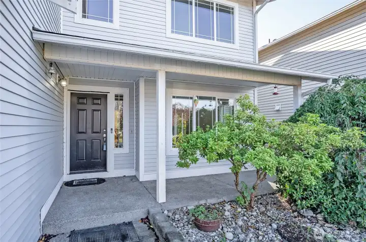 The covered front porch offers a welcoming space to sit back and relax.