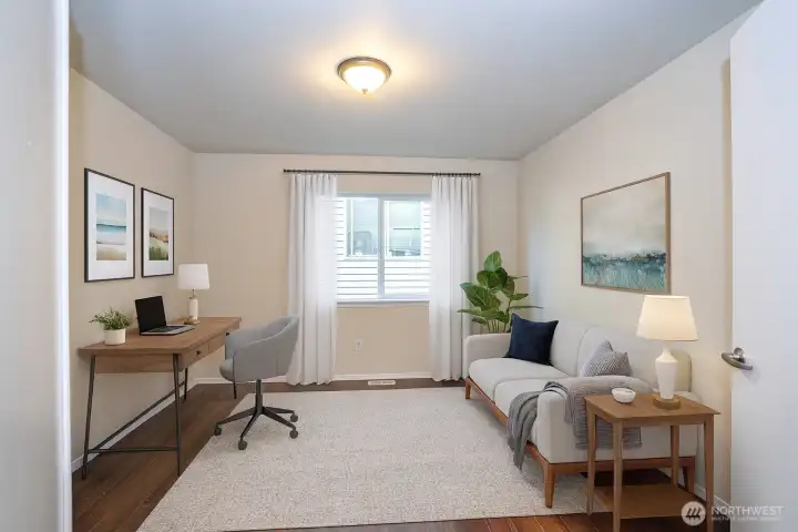 Perspective into the main-floor den/office, showcasing its inviting layout and elegant design - Virtually staged to inspire your vision of the space.