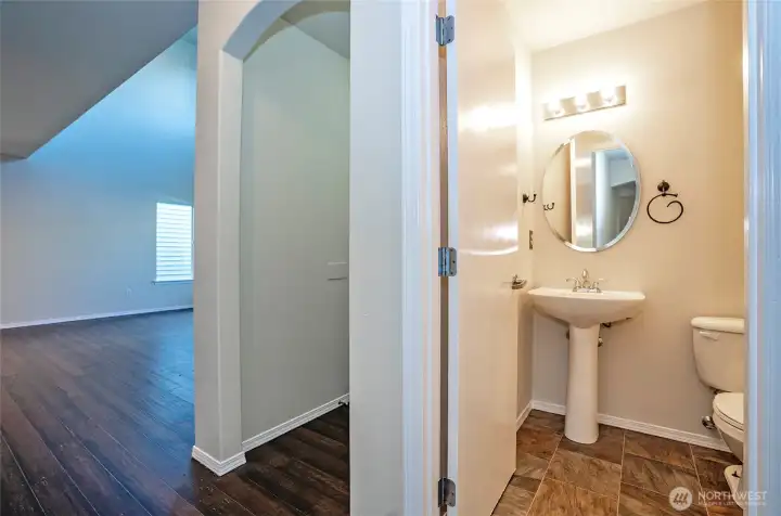 Conveniently located just off the den/office, the main-floor powder room adds functionality and ease to the layout.