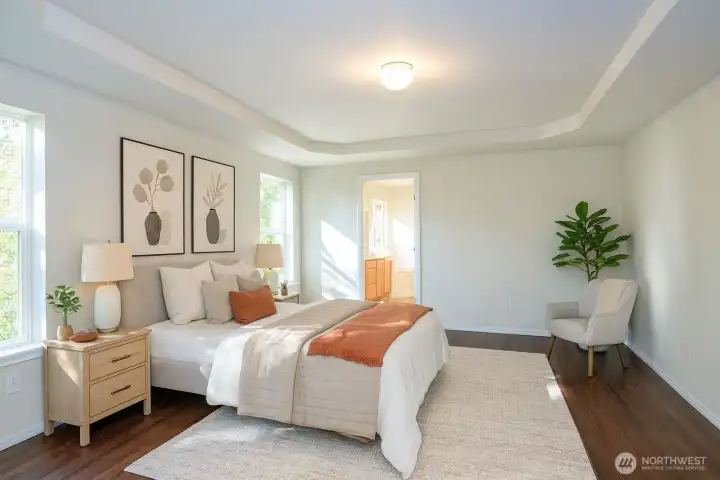 Step into the grand, expansive primary suite—a serene retreat where the stress of the day simply melts away - Virtually staged to inspire your vision of the space.