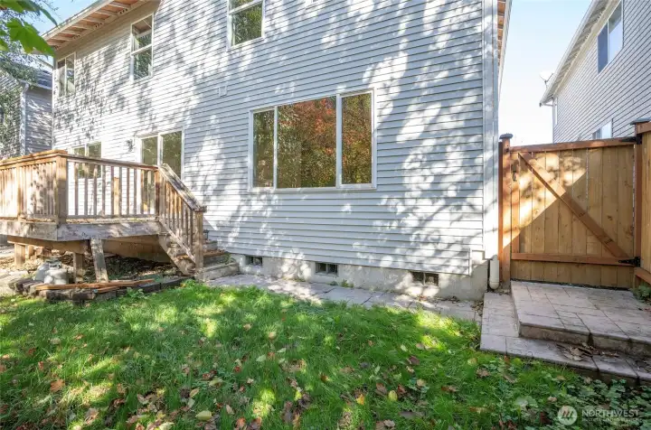 Side gate in the backyard providing added convenience.