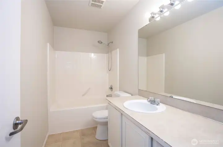 Full guest bathroom located on the upper level.