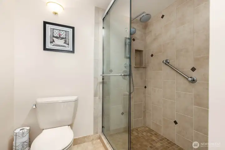 Private water closet area adds comfort and functionality to the primary bath layout.