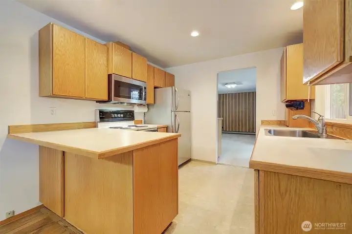 The kitchen counter has space for barstools.