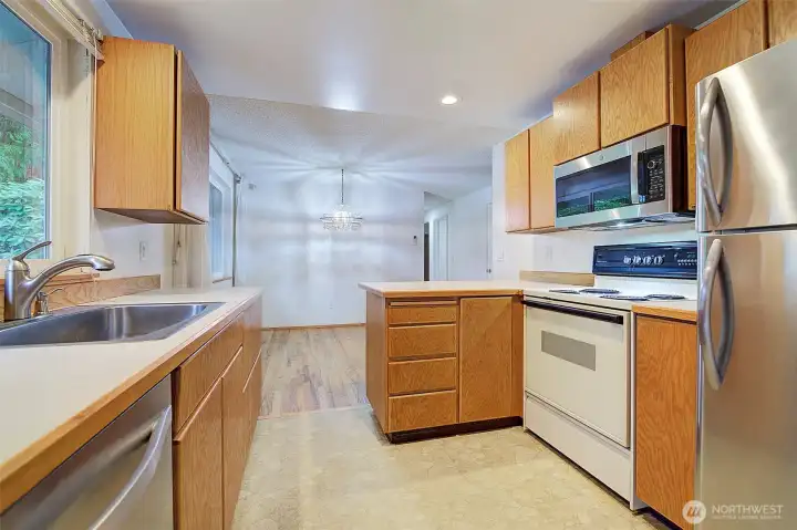 Stainless steel refrigerator, dishwasher and microwave.