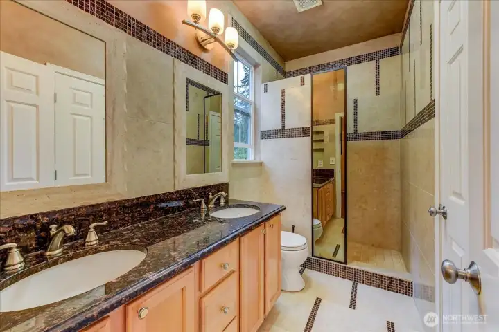 Luxurious tile finishes in the Jack and Jill en-suite bath