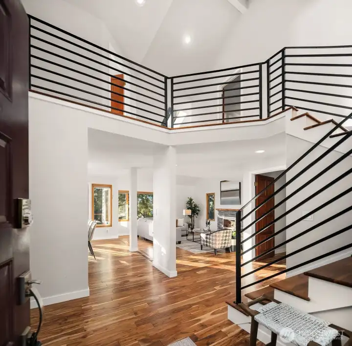 Vaulted ceilings, skylights, and warm acacia wood floors make a light and welcoming entry.