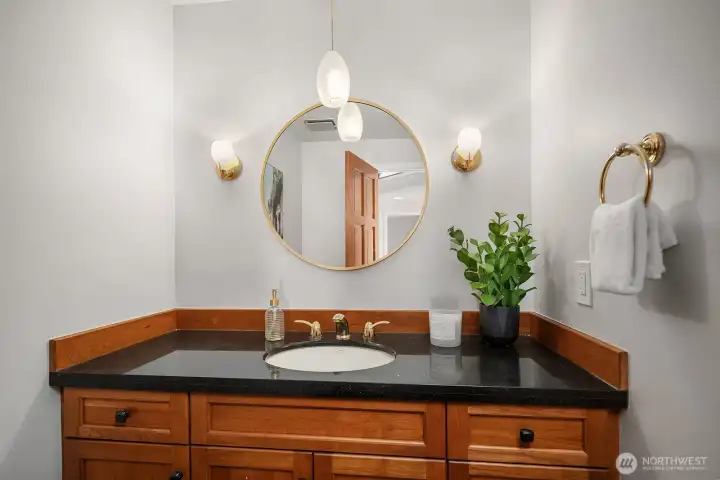 Powder room near the entry on the main level is convenient for guests.