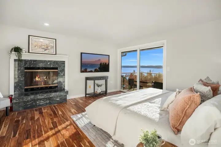 The primary suite has its own fireplace and balcony. Wake up to this gorgeous view every morning!