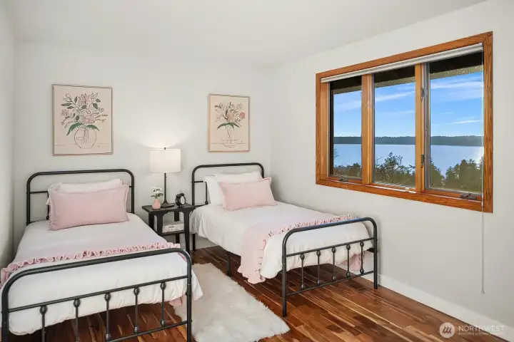 The second bedroom also enjoys serene water views.