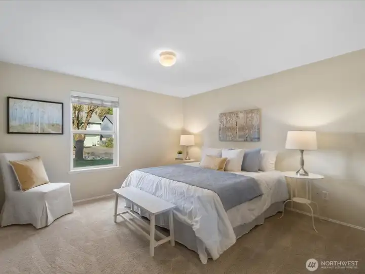 The large primary bedroom. There is new carpeting in each of the bedrooms.