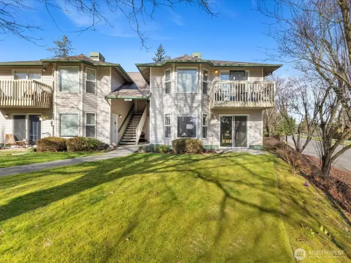 Mature trees and open lawn create a welcoming atmosphere.