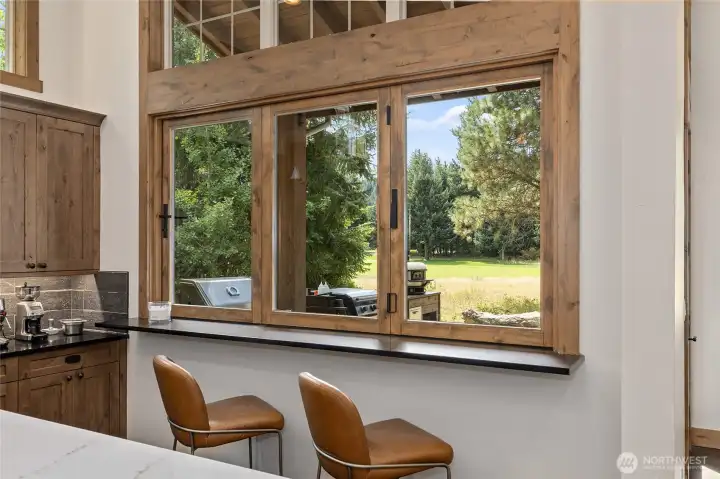 Extra kitchen eating space and folding window, great for cooking and brining in fresh mountain air!