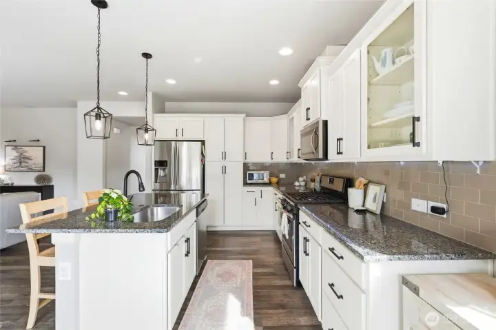 Lovely kitchen open to the main floor living area and eating nook