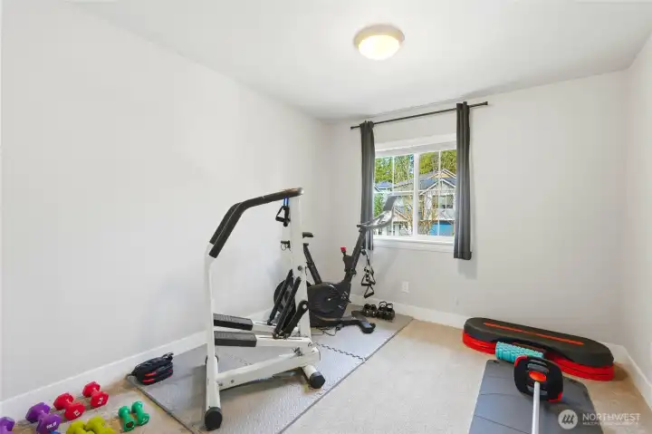 additional upper level bedroom, currently set up as a exercise room