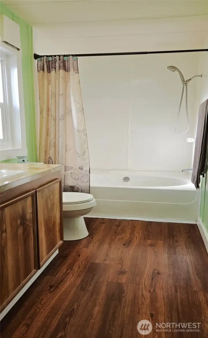 Primary Bathroom has oversized soaking tub and window