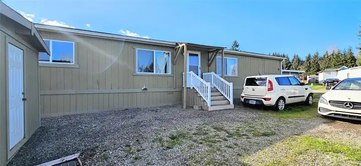 Front Entry with covered patio and shed