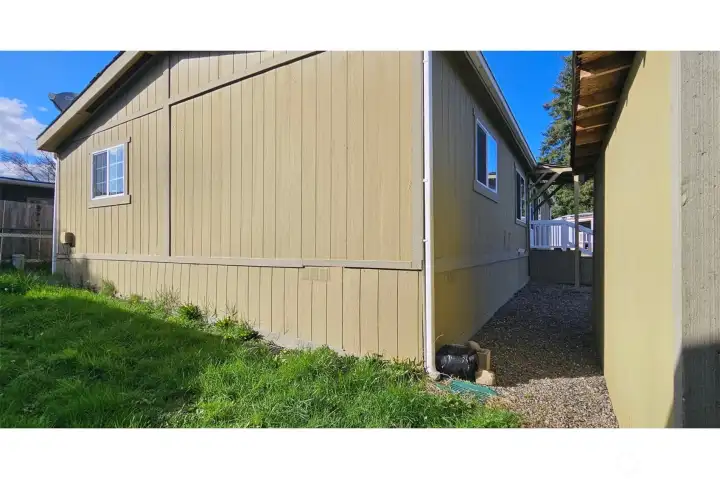 Back of home between home and shed on right