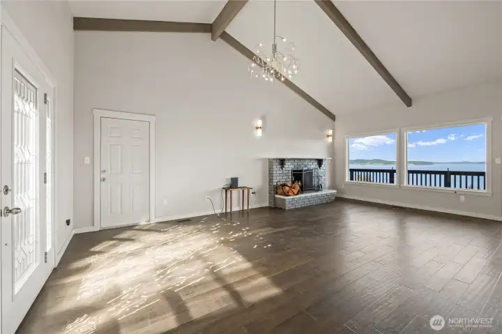 Cozy wood burning firelace with large view windows.