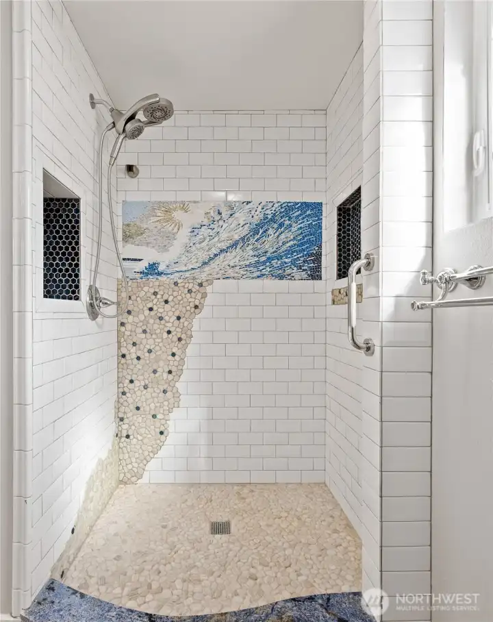 Walk-in shower with natural detail finishes.