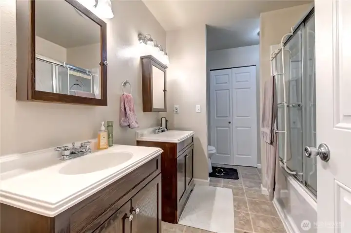 Full bathroom with double vanity on second floor