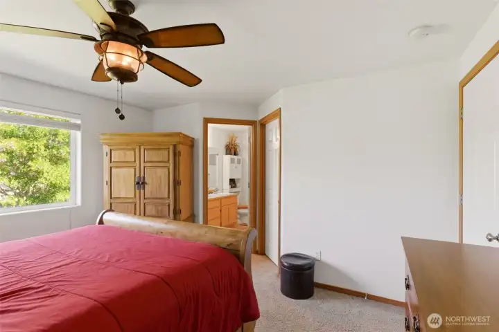 Primary bedroom with walk in closet and en-suite bath