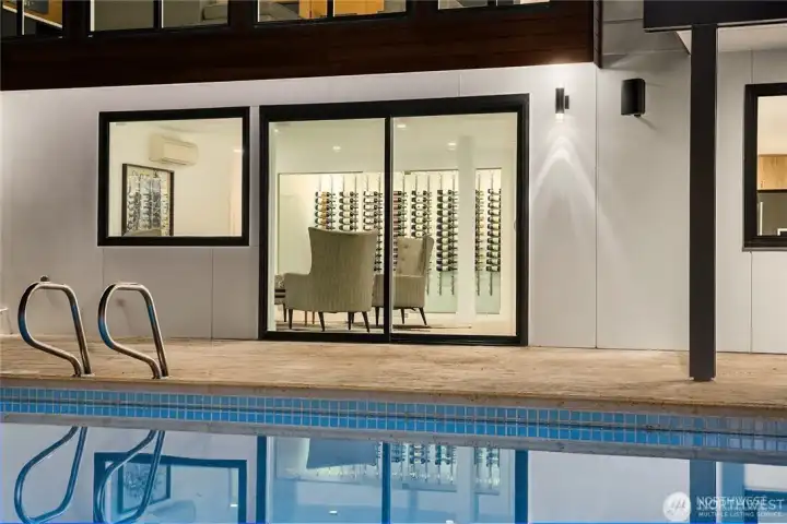 Pool with sliding glass doors to lower level.