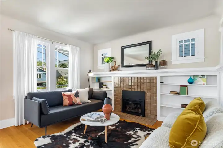 Charming living room with newer gas fireplace and hardwood floors