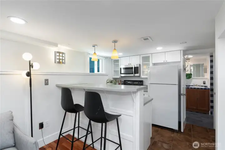 Daylight basement kitchen with sit-in bar