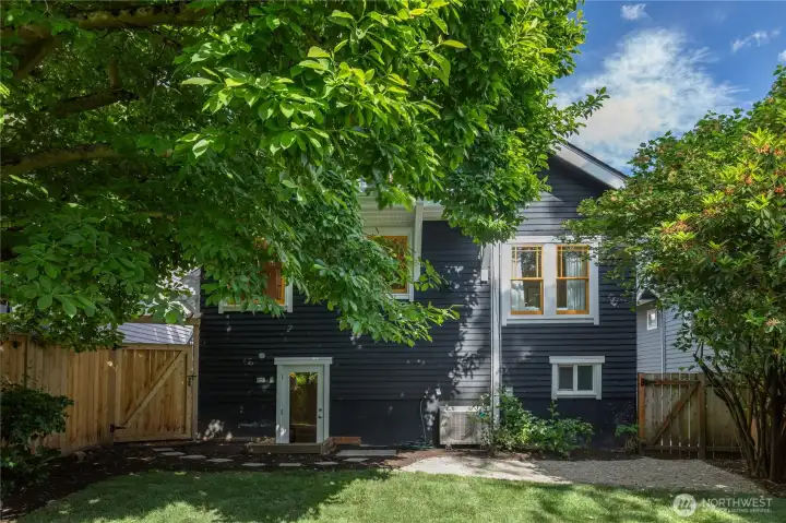 Fully fenced backyard with updated landscaping