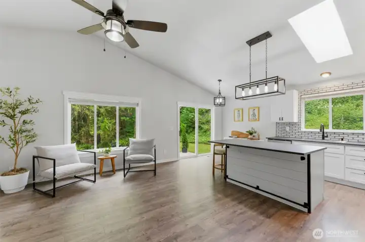 Seamless indoor-outdoor living. Enjoy the open great room with a direct line of sight through the sliding glass doors to your private, wooded backyard.