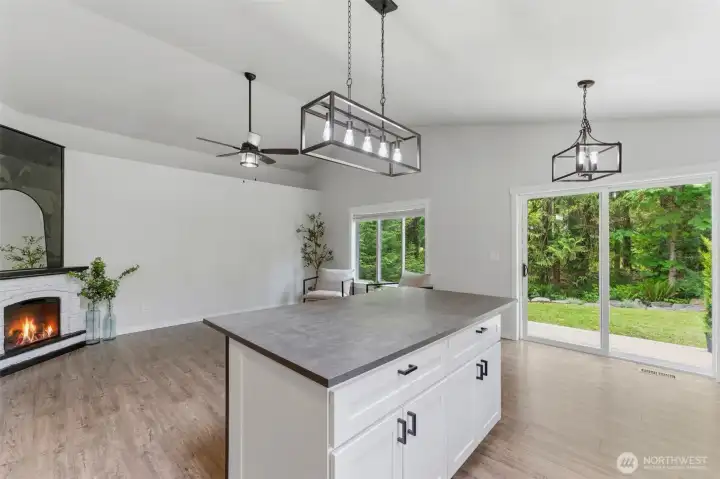 Pull up a stool! The large center island with a breakfast bar is the perfect spot for morning coffee, casual dining, or party prep.