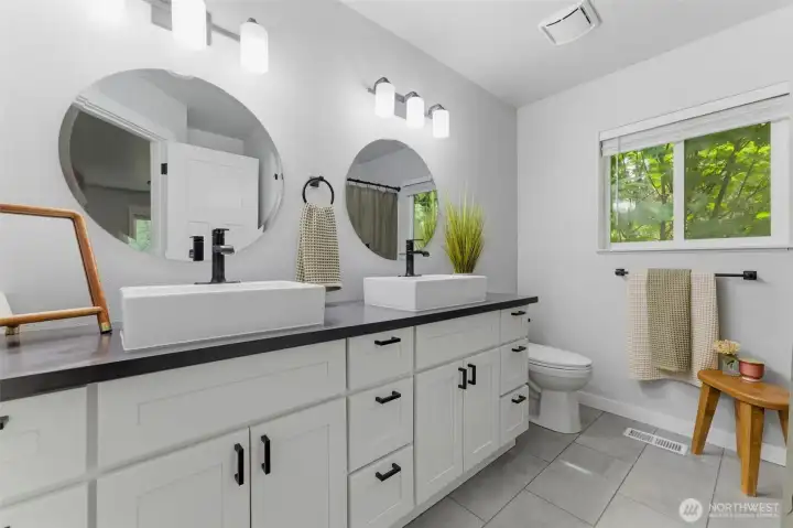 Clean, modern, and bright. The primary bathroom continues the home's impeccable attention to detail with updated fixtures and excellent lighting.