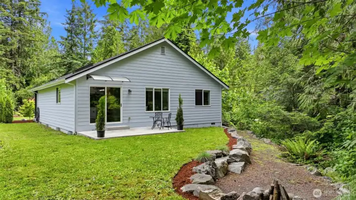 Pure PNW bliss. Looking back toward the home from the campfire area, you can truly appreciate the supreme peace, quiet, and complete privacy this property offers.
