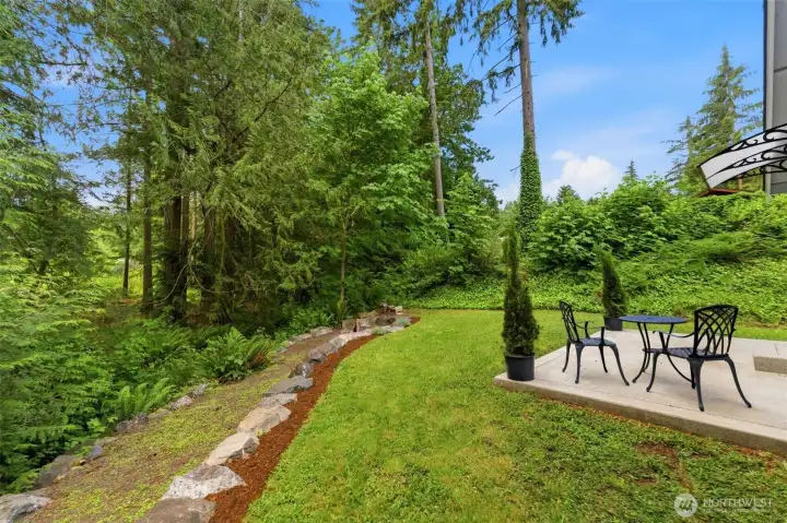 Nature at your doorstep! A beautiful seasonal creek runs along one side of the property, enhancing the tranquil, park-like atmosphere of this unique backyard.