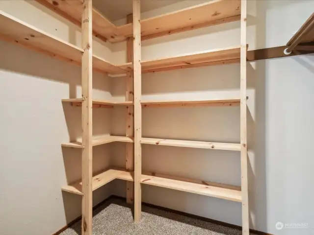 Primary bedroom features built-in shelving.